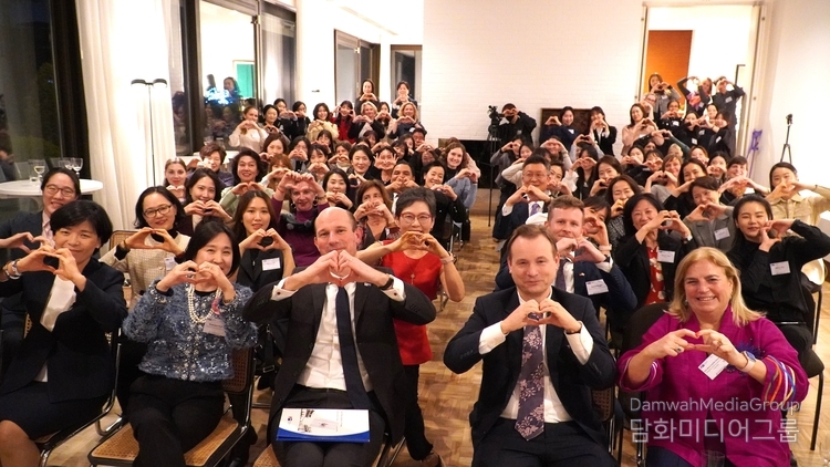 Participants of the 6th ‘Women In koRea’ mentorship program kick-off event, co-hosted by KGCCI and German Embassy, strike the #IndspireInclusion heart hand pose for International Women's Day on March 8, 2024. / Courtesy of KGCCI