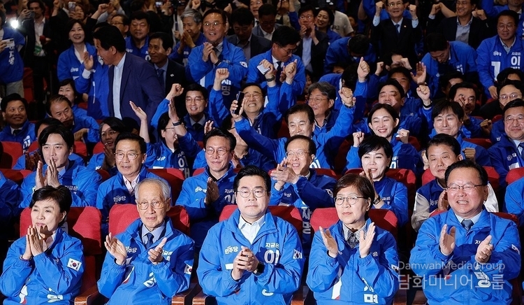 Officials of the liberal Democratic Party are joyous at the National Assembly in Seoul on June 3, 2025 as Democratic Party candidate Lee Jae-myung was elected as the 21st President.